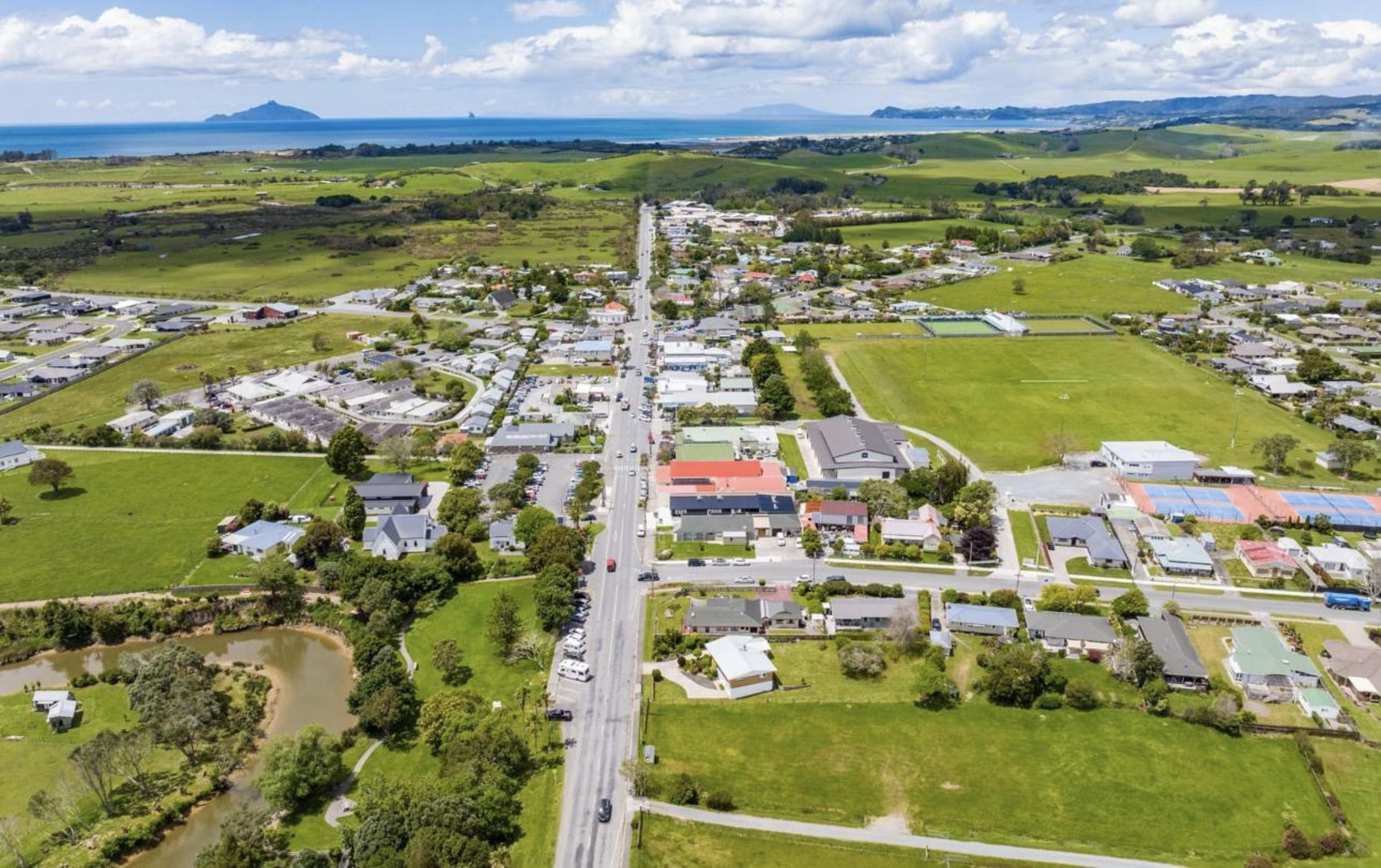 Aerial view of Waipu township with Bream Bay beyond